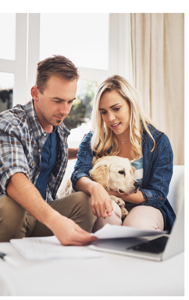 family with dog reading an important document together