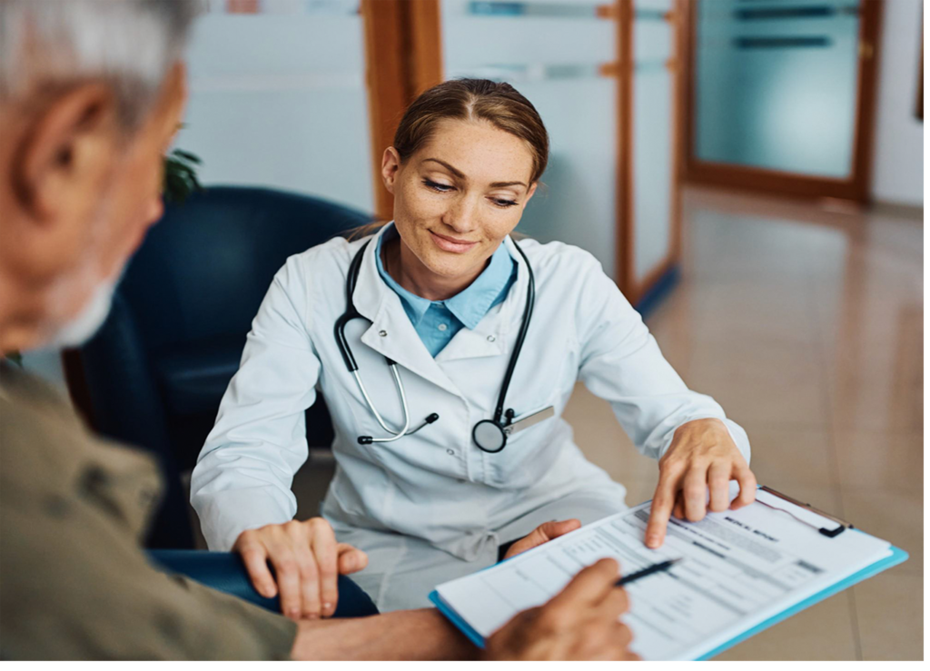 An elderly man receiving a medical consultation from a doctor