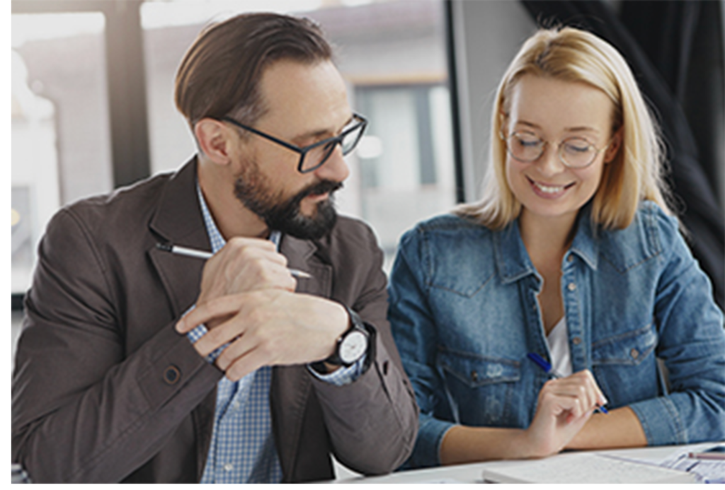 Man and woman working together at a desk