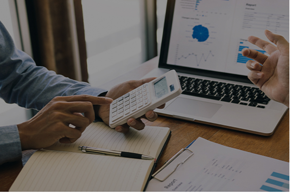 Man using a calculator to check figures