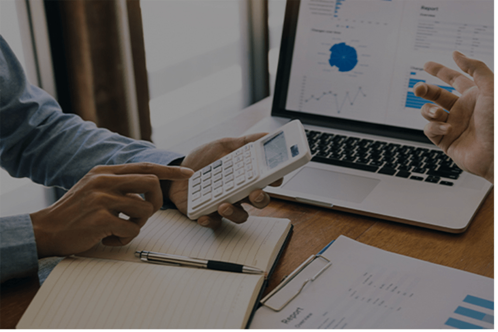 Man using a calculator to check finances