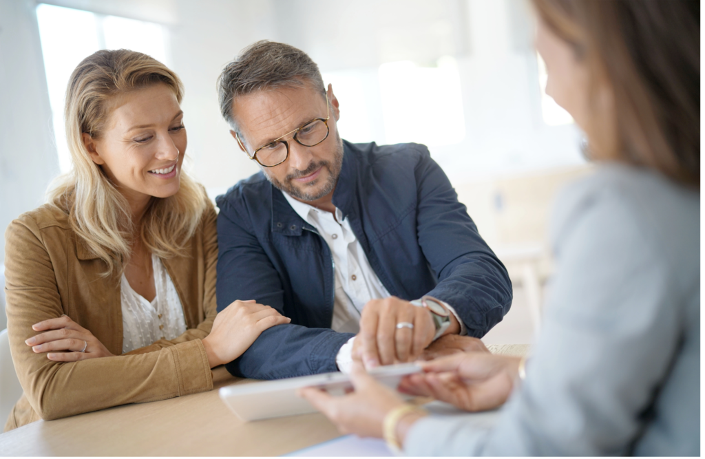 Couple signing a form